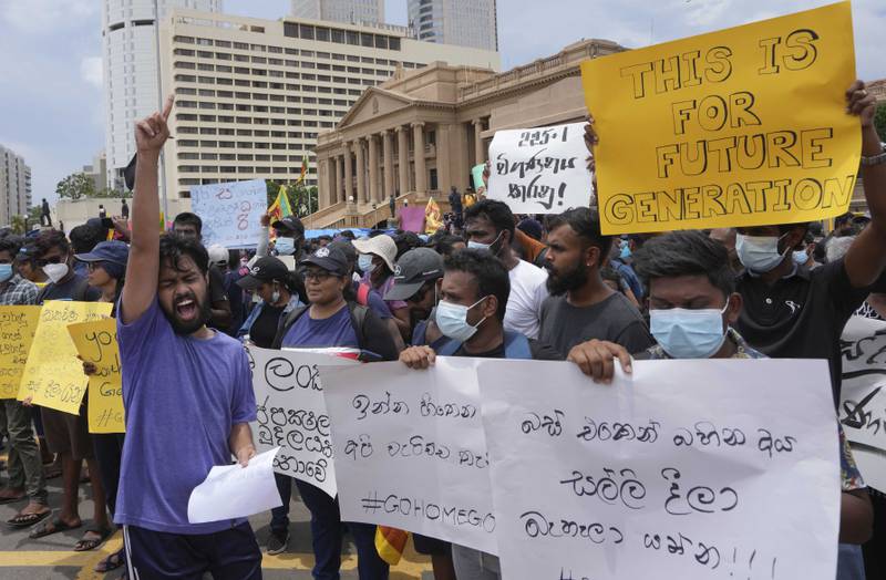 Sri Lankans protest outside the president's office in the capital Colombo. AP