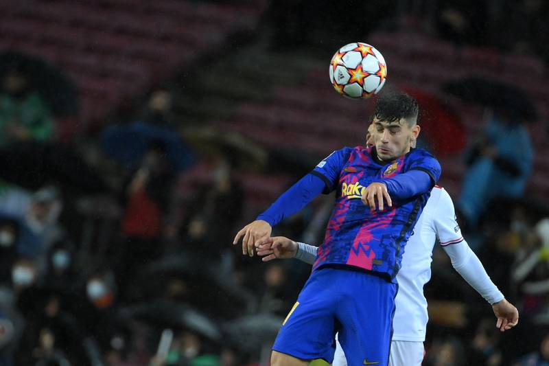 Barcelona's Austrian forward Yusuf Demir heads the ball during the Champions League Group E match against Benfica at Camp Nou on November 23, 2021. The match ended 0-0. AFP