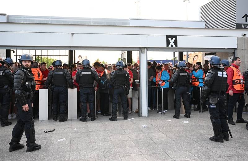 Liverpool fans are seen queuing outside the stadium. Getty