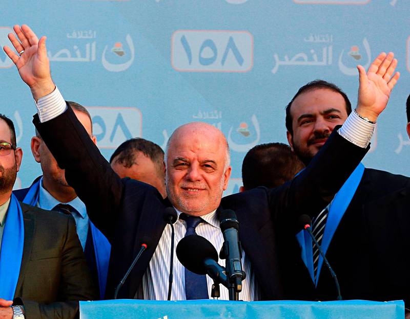 FILE - In this May 1, 2018 file photo, Iraq Prime Minister Haider al-Abadi, speaks during a campaign rally in Baghdad, Iraq. Thereâ€™s a mixture of hope and apathy among Iraqâ€™s minority Sunnis ahead of the May 12 parliamentary election. When al-Abadi took over as prime minister in 2014, he pledged to end sectarian politics. The military defeat of the Islamic State group delivered millions from its harsh rule, but has left more than 2 million people, mostly Sunnis, displaced from their homes amid heavy destruction that will cost billions of dollars to repair. (AP Photo/Hadi Mizban, File)