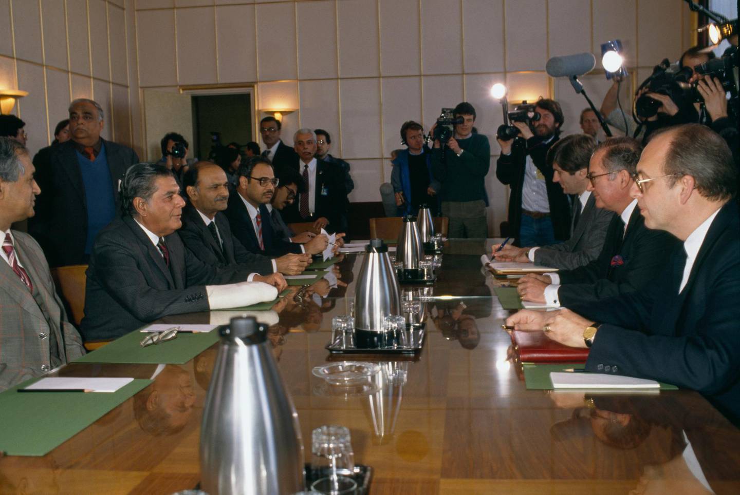Independant speakers and journalists attend the United Nations in Geneva in March of 1988 for discussions on the war in Afghanistan. Pakistan Foreign Affairs Minister Zain Noorani (arm in plaster) was present and Special Advisor to the UN Secretary General Diego Cordovez (middle right seated) conducted the negotiations that culminated in the 1988 Geneva accords leading to the Soviet troops withdrawal from Afghanistan. (Photo by THIERRY ORBAN/Sygma via Getty Images)