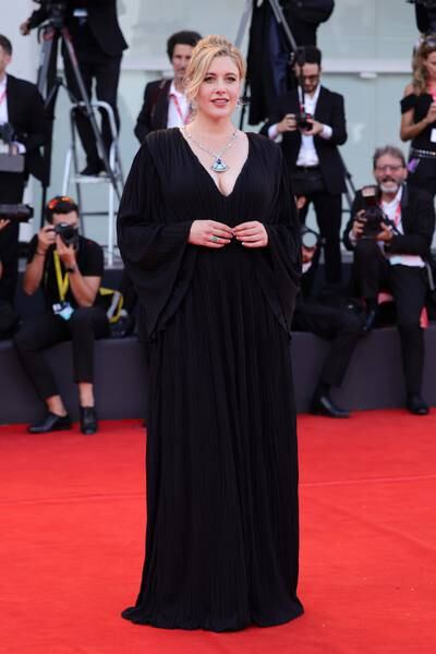 Greta Gerwig wears a black dress. Getty Images 