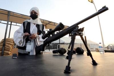 Mona Al Khurais loads bullets into the magazine before conducting long-range rifle training at Top Gun.