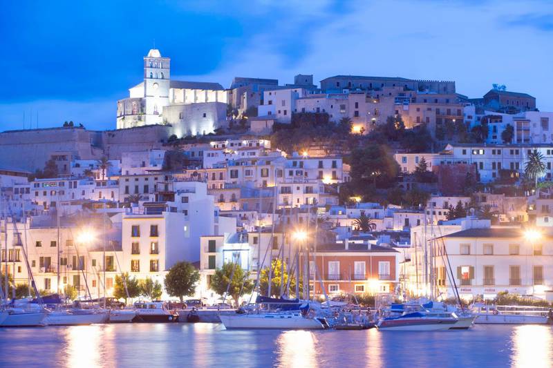 Spain, Balearic Islands, Ibiza, old town from harbour. Getty Images