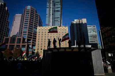 People take part in a rally against the Iranian government in Vancouver, Canada, on Saturday. AP