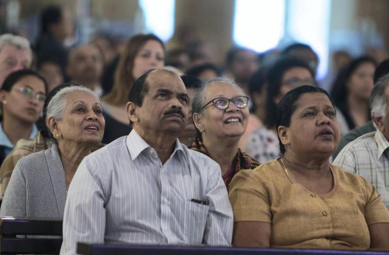 DUBAI, UNITED ARAB EMIRATES - Worshippers are emotional upon seeing the Pope on the screen at St. Mary's Church, Oud Mehta.  Leslie Pableo for The National for Nick Webster's story