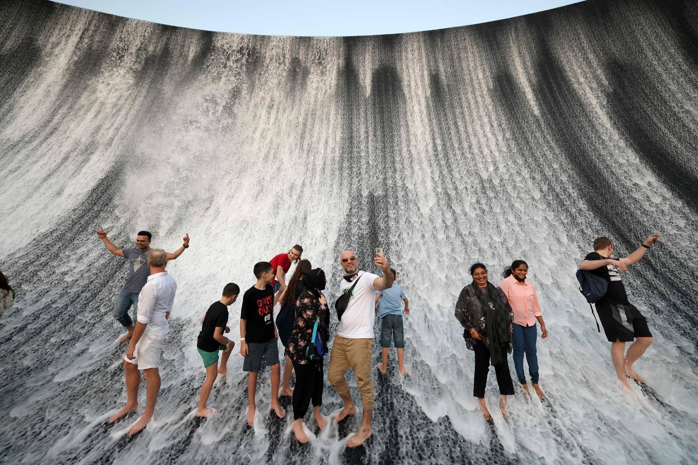 Visitors soak in the Surreal water feature at the World's Fair in Dubai. Photo: AFP