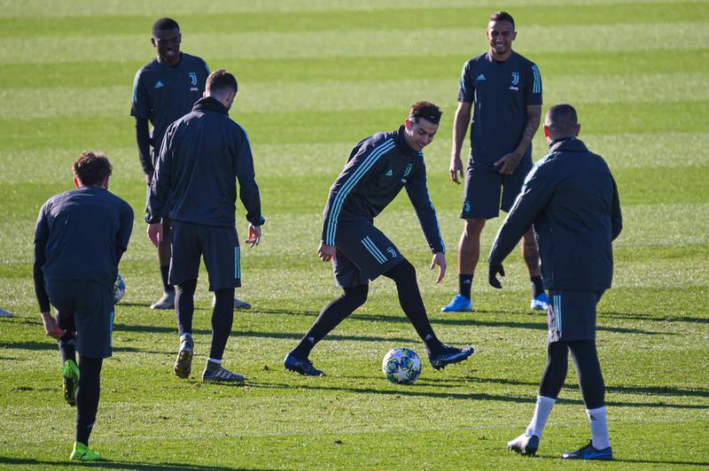 Juventus' Portuguese forward Cristiano Ronaldo (C) jokes with teammates. AFP