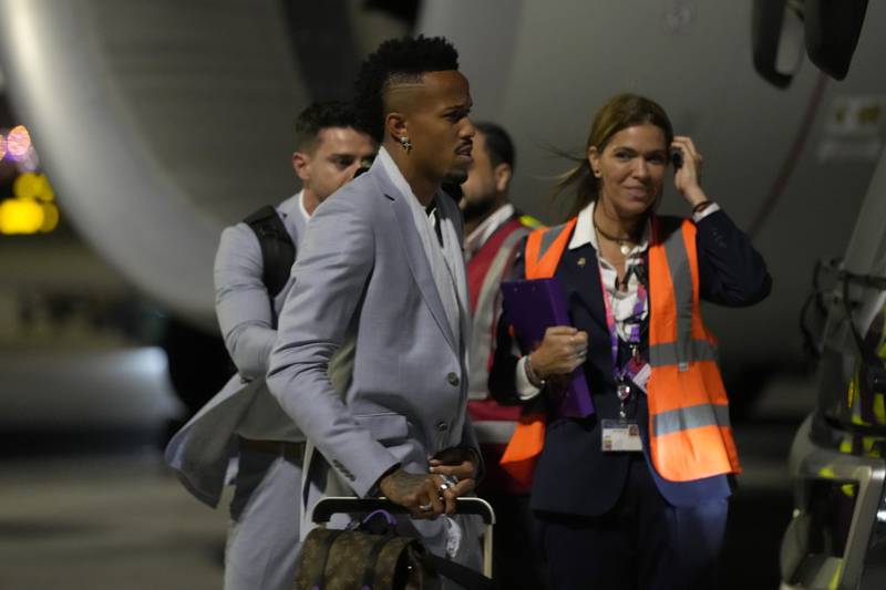 Eder Militao arrives with teammates at Hamad International Airport. AP