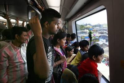 Commuters take the Mumbai metro on the first day of its opening. The metro line is expected to carry about 11,00,000 passengers every day, with at least 1,500 passengers per train. Rafiq Maqbool / AP Photo