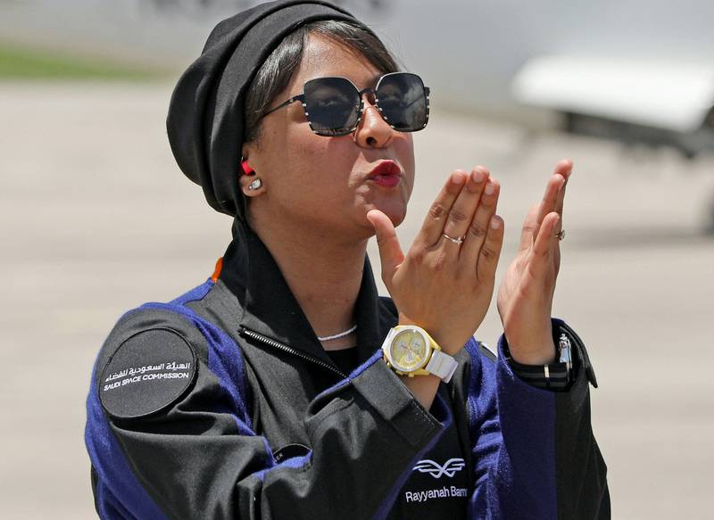 Ms Barnawi blows kisses to family members upon her arrival at the Kennedy Space Centre. AFP