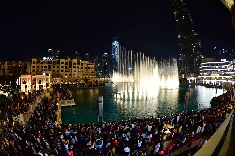 People attend the fountain show in downtown Dubai. AFP