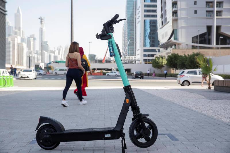 DUBAI, UNITED ARAB EMIRATES. 26 OCTOBER 2020. E-scooter trials rolled out in five areas across city for a year long project for commuters to rent and use e-scooters while commuting to and from tram and metro stations. A TIER e-scooter for rent at the DMCC Metro Station in JLT. (Photo: Antonie Robertson/The National) Journalist: Kelly Clarke. Section: National.