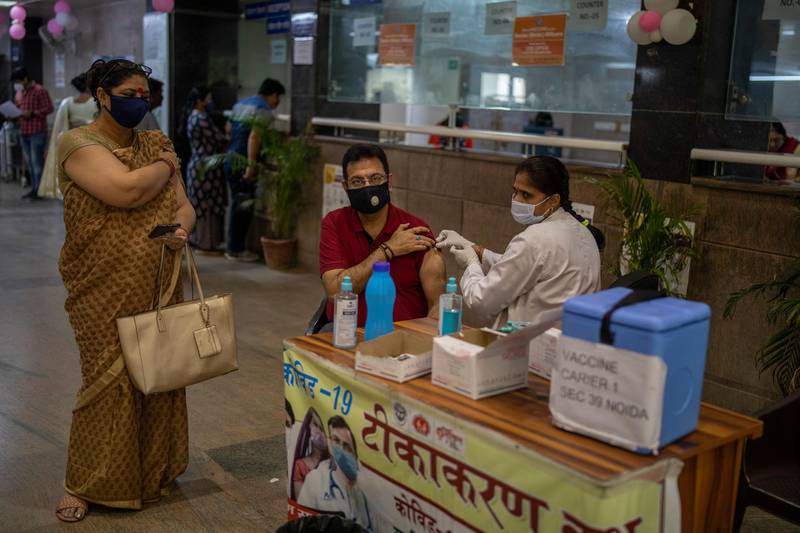A man is immunised against Covid-19 at a government hospital in Noida, a suburb of New Delhi, India, on April 7, 2021. AP