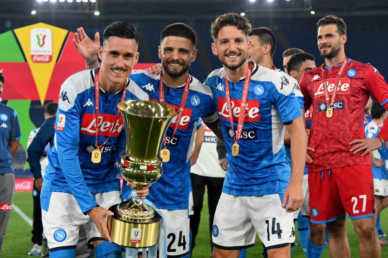 José Maria Callejon, Lorenzo Insigne and Dries Mertens celebrating with the trophy. Getty