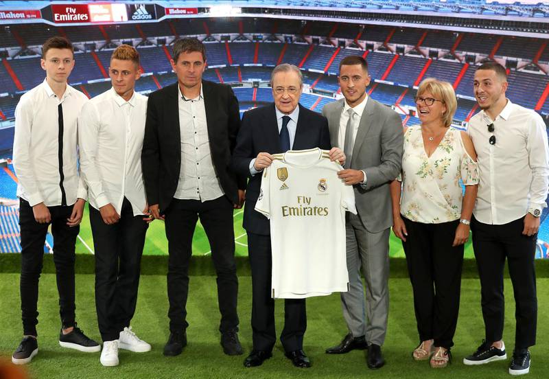 Eden Hazard poses for photos with Real Madrid president Florentino Perez and his family. Getty Images