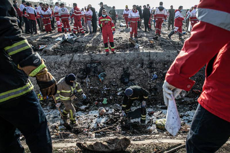 08 January 2020, Iran, Shahedshahr: Rescue workers search the scene, where a Ukrainian airplane carrying 176 people crashed on Wednesday shortly after takeoff from Tehran airport, killing all onboard. Photo: Foad Ashtari/dpa (Photo by Foad Ashtari/picture alliance via Getty Images)