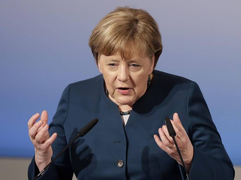 German chancellor Angela Merkel speaks during the Munich Security Conference. Matthias Schrader / AP Photo