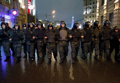 Police officers block a street behind a former KGB building after a rally in downtown Moscow, Monday, Dec. 5, 2011. Several thousand people have protested in Moscow against Prime Minister Vladimir Putin and his party, which won the largest share of a parliamentary election that observers said was rigged. A group of several hundred then marched toward the Central Elections Commission near the Kremlin, but were stopped by riot police and taken away in buses.(AP Photo/Alexander Zemlianichenko) *** Local Caption ***  Russia Election Protest.JPEG-010d6.jpg