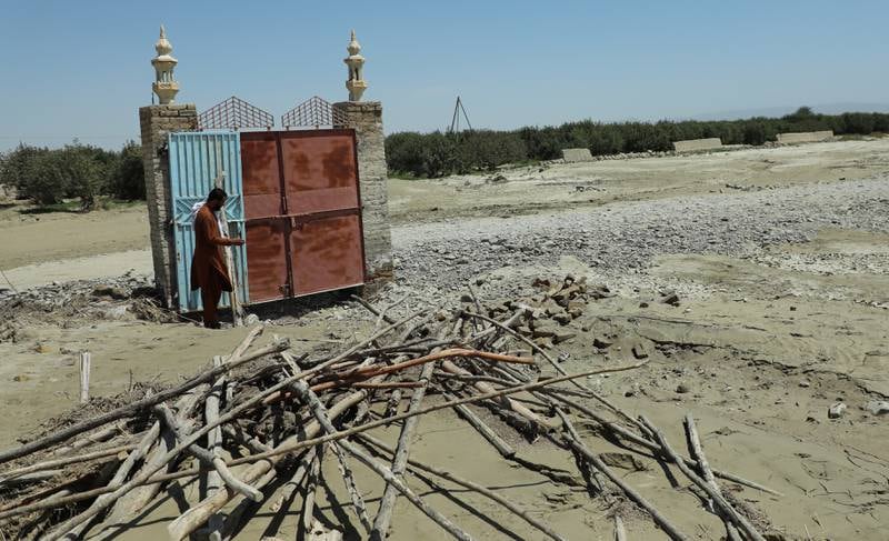 A man on the site of a mosque that was washed away by floods in Balochistan province, Pakistan. According to disaster management authorities about 160 bridges and 5,000 kilometres of roads have been destroyed or damaged. More than 33 million people are affected by the floods, the country's climate change minister said. EPA 