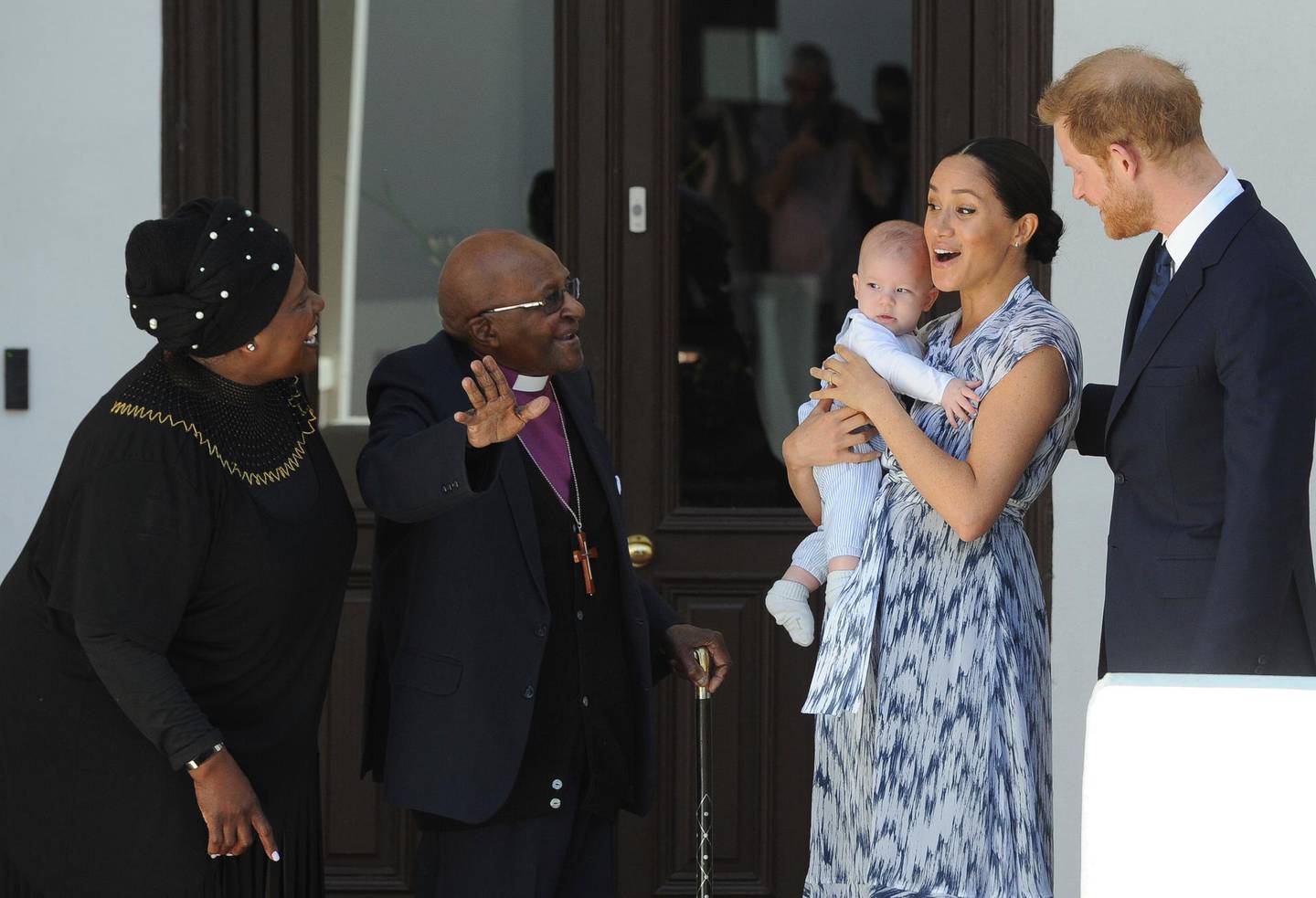 Britain's Prince Harry and Meghan, Duchess of Sussex, holding their son Archie, meets with Anglican Archbishop Emeritus, Desmond Tutu, and his wife Leah in Cape Town, South Africa, Wednesday, Sept. 25, 2019. The royal couple are on the third day of their African tour. (Henk Kruger/African News Agency via AP, Pool)