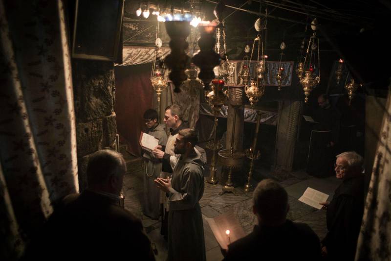 Christians attend a service at the Grotto in Bethlehem. AP Photo