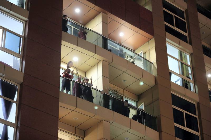 DUBAI, UNITED ARAB EMIRATES , March 25 – 2020 :- UAE residents cheering from their balconies and homes on Wednesday night at Al Mankhool area in Bur Dubai for doctors and medical staff for their tireless efforts in these critical times in Dubai. (Pawan Singh / The National) For News/Online/Standalone/Instagram