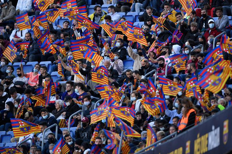 Supporters wave club's flags from the stands, during the presentation ceremony of  Dani Alves. AFP