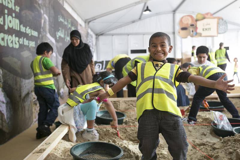 Abdullah, 5, takes part in an archaeological dig at the 2014 Abu Dhabi Science Festival on the Abu Dhabi Corniche. Mona Al Marzooqi / The National