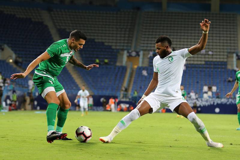 Saudi Arabia's Ali Albulhy, right, in action against Iraq's Ahmed Yassin in Riyadh, Saudi Arabia. The match at the King Saud University Stadium finished 1-1. EPA