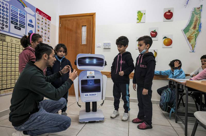 Mr Al Rozy (and the robot) teach at the private school in Gaza City.