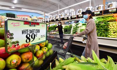 Supermarket shoppers in Rosemead, California. High food prices are causing hardship for some Americans. AFP