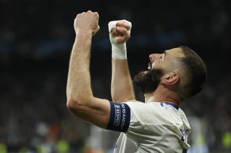 Real Madrid's Karim Benzema celebrates after scoring in the 3-1 comeback win over of PSG in the Champions League last-16 second leg on March 9, 2022. EPA