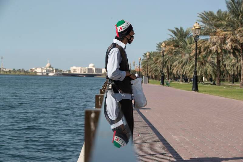 A man relaxes on the Buhaira Corniche.