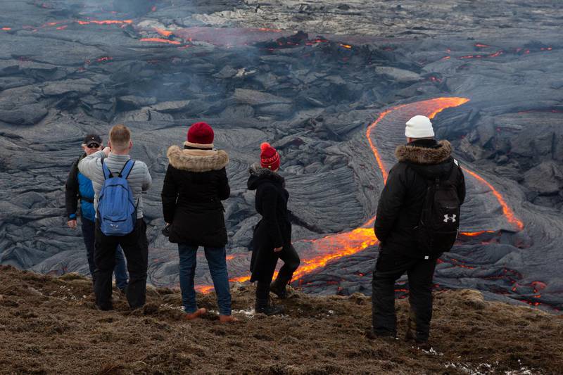 Spectators look over the lava field. Getty Images