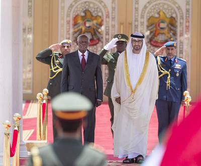 Sheikh Mohammed bin Zayed, Crown Prince of Abu Dhabi and Deputy Supreme Commander of the UAE Armed Forces and José Eduardo dos Santos, president of Angola, stand for the national anthem in Mushrif Palace on Sunday. Donald Weber  / Crown Prince Court - Abu Dhabi