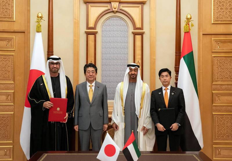 ABU DHABI, UNITED ARAB EMIRATES - January 13, 2020: Sheikh Mohamed bin Zayed, Crown Prince of Abu Dhabi and Deputy Supreme Commander of the UAE Armed Forces (2nd R) and HE Shinzo Abe, Prime Minister of Japan (3rd R), stand for a photograph after witnessing an MOU signing ceremony during a reception, at Qasr Al Watan. Seen with HE Dr Sultan Ahmed Al Jaber, UAE Minister of State, Chairman of Masdar and CEO of ADNOC Group (L) and HE Makihara Hideki, State Minister of Economy, Trade and Industry of Japan (R). Hamad Al Kaabi / Ministry of Presidential Affairs 