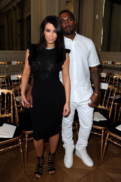 PARIS, FRANCE - JULY 04:  Kim Kardashian and Kanye West attend the Valentino  Haute-Couture show as part of Paris Fashion Week Fall / Winter 2012/13 at Hotel Salomon de Rothschild on July 4, 2012 in Paris, France.  (Photo by Pascal Le Segretain/Getty Images)