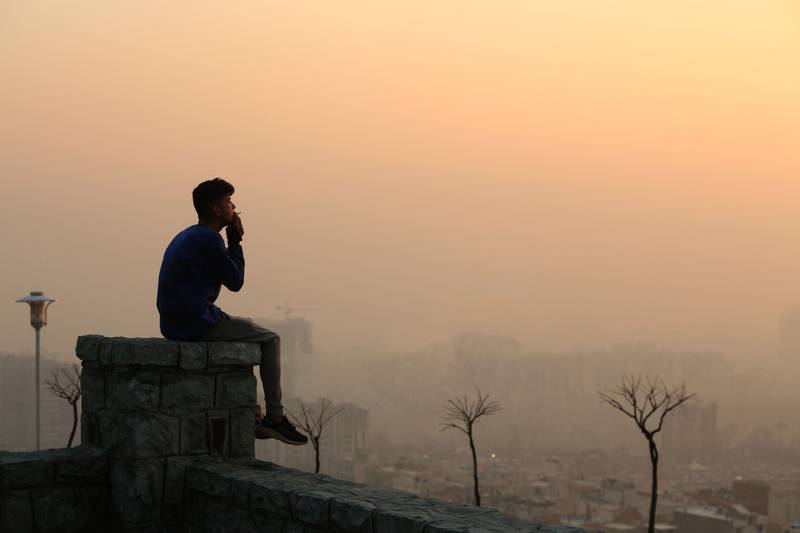 Smog obscures the view from the Saad Abad complex north of the Iranian capital Tehran in January, 2021. AFP