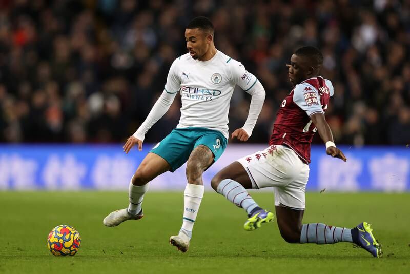 Manchester City forward Gabriel Jesus is challenged by Aston Villa midfielder Marvelous Nakamba. Getty Images