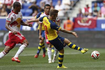 Arsenal's Jack Wilshere shoots against New York Red Bulls during their friendly on Saturday. Jeff Zelevansky / Getty Images / AFP