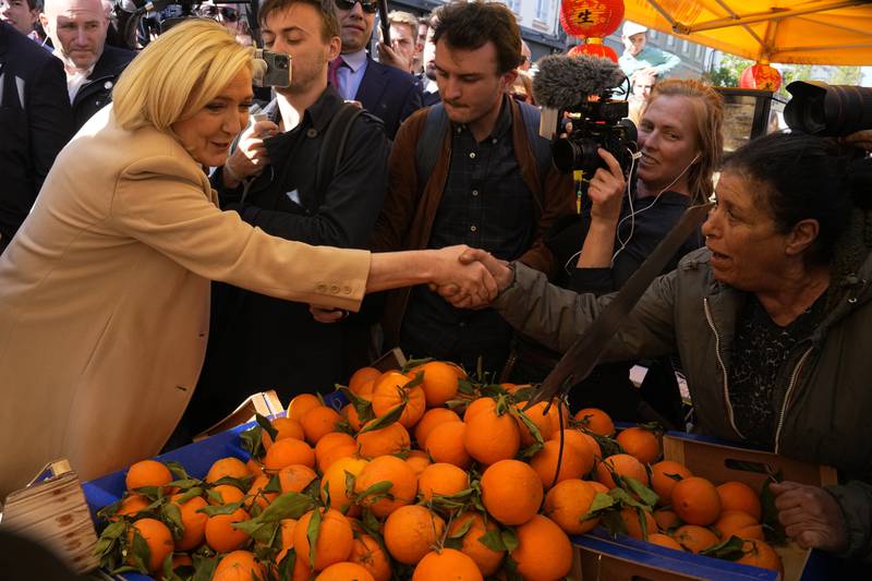 Ms Le Pen campaigns at a street market in Etaples, northern France. AP Photo
