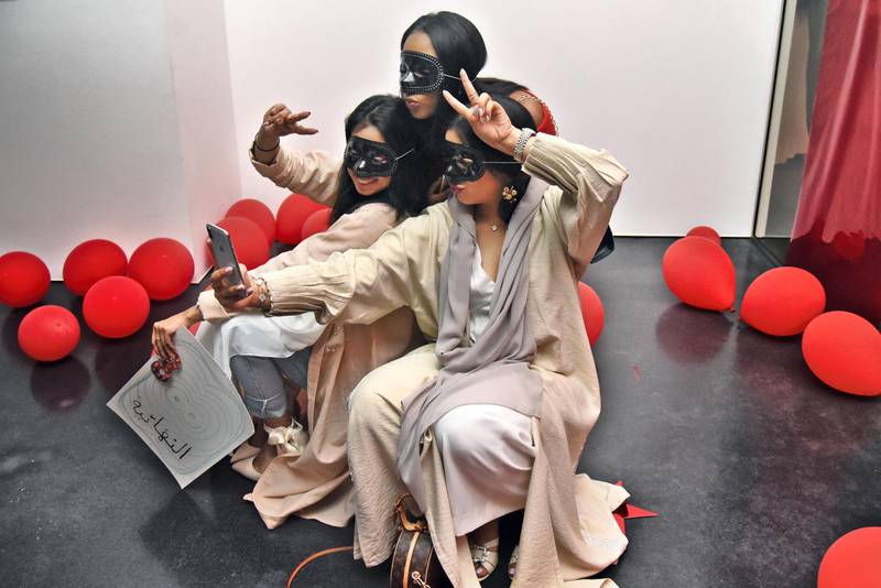 Dubai, UAE, 26 April 2019, Women wearing masks pose for a selfie during The Youth Takeover program at the Jameel Arts Centre. Photos by Shruti Jain