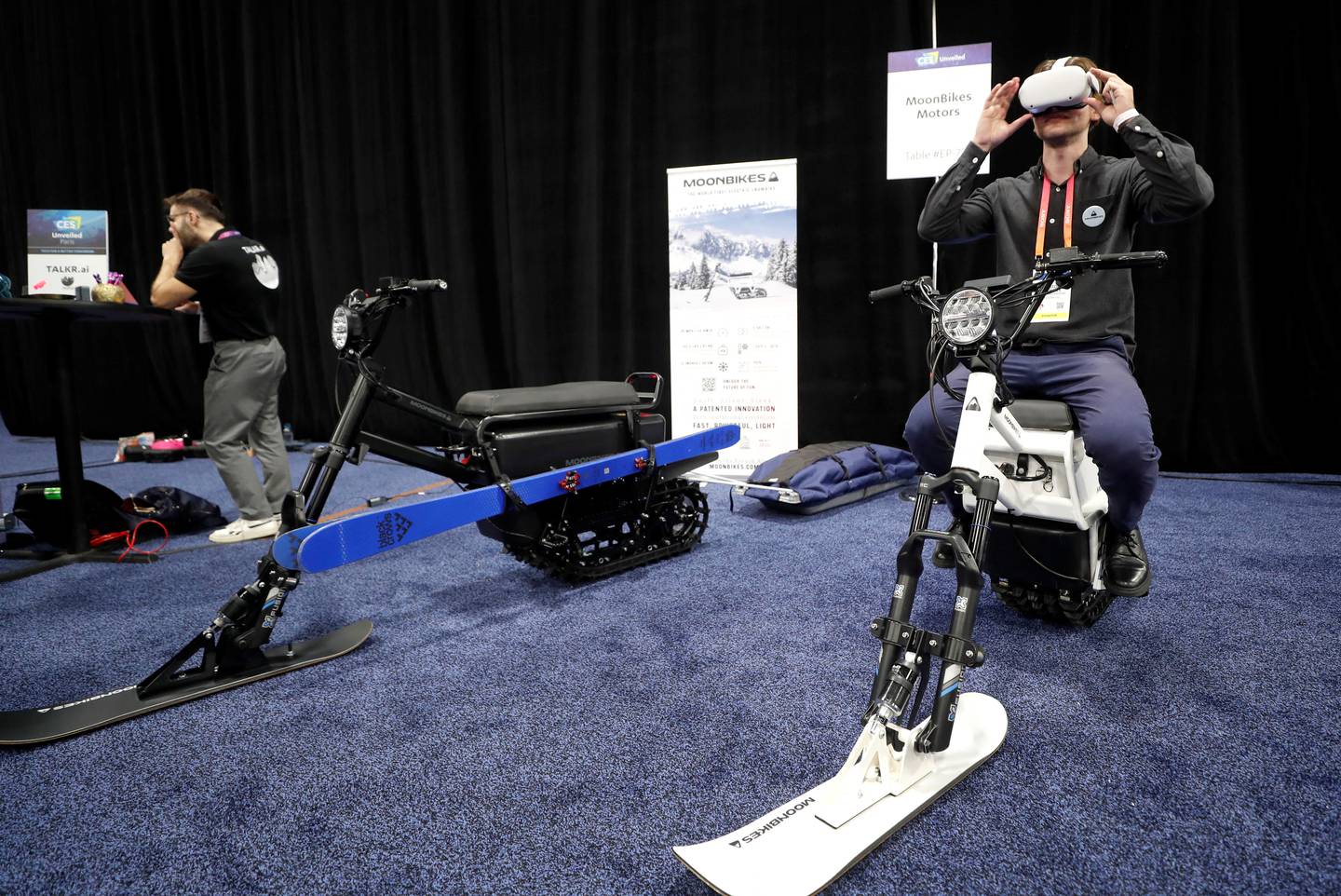 Gaston LaChaize of Moonbikes Motors uses virtual-reality goggles as he sits on an electric snowbike during the CES Unveiled press event in Las Vegas. Reuters