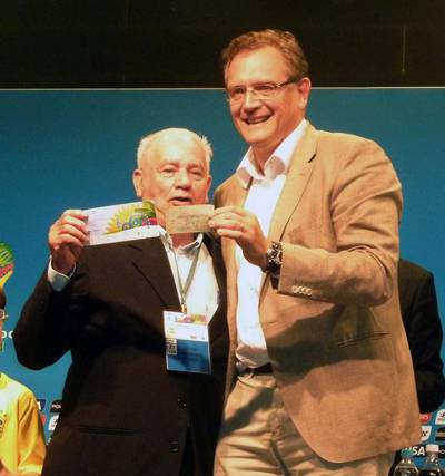 Joedir Belmont, left, and Fifa's Jerome Valcke trade tickets from the 1950 and 2014 World Cup finals at the Maracana Stadium in Rio de Janeiro, Brazil on June 27, 2014. Belmont, 85, had a ticket for the 1950 World Cup final match between Brazil and Uruguay, but he skipped it to tend to his sick mother. He has offered to donate his unused 1950 ticket for display in Fifa's planned museum at its Zurich headquarters. In return, the football governing body has given him two tickets to this year's World Cup final match. Kyodo  