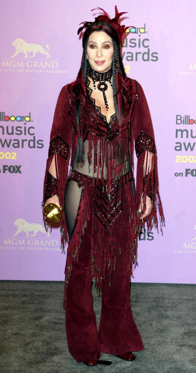 Singer Cher poses for photographers with her 'Artist Achievement Award' during  the Billboard Music Awards at the MGM Grand Hotel in Las Vegas.  *   The awards, in it's 14th year, recognises the artists and the songs that have climbed to the top of the American charts throughout the year.   (Photo by Anthony Harvey - PA Images/PA Images via Getty Images)