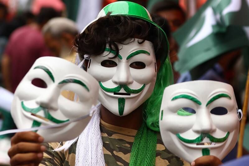 A trader in Karachi sells masks in the national colours as the nation prepares to celebrate 75 years since it gained independence from British rule in 1947. EPA