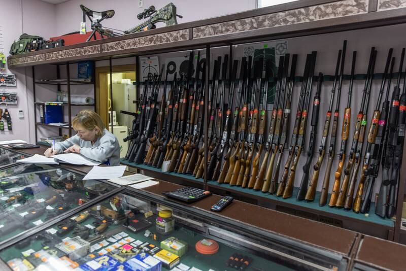 A woman works in a gun shop in the capital. Getty Images