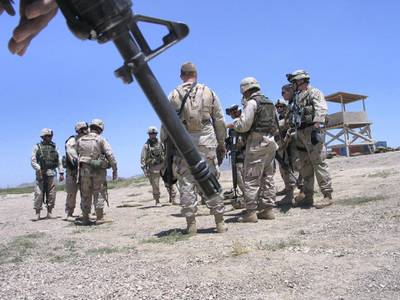 U.S. soldiers gather during an exercise at the Kandahar airbase in Afghanistan June 18, 2005. Afghan and U.S. troops backed by warplanes have killed more than 60 Taliban guerrillas in southwestern Afghanistan in the bloodiest fighting in months, officials said on Wednesday. Picture taken June 18, 2005. REUTERS/Ismail Sameem  AM/DY