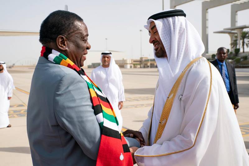 ABU DHABI, UNITED ARAB EMIRATES - March 16, 2019: HH Sheikh Mohamed bin Zayed Al Nahyan Crown Prince of Abu Dhabi Deputy Supreme Commander of the UAE Armed Forces (R), receives HE Emmerson Mnangagwa, President of Zimbabwe (L), at the Presidential Airport. 

( Ryan Carter for the Ministry of Presidential Affairs )
---
